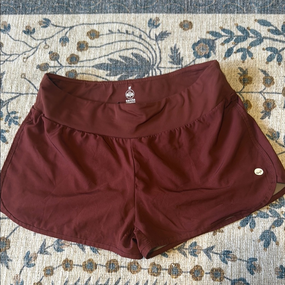 Senita Athletics Burgundy/wine shorts with pockets and contrast polka dot liner
